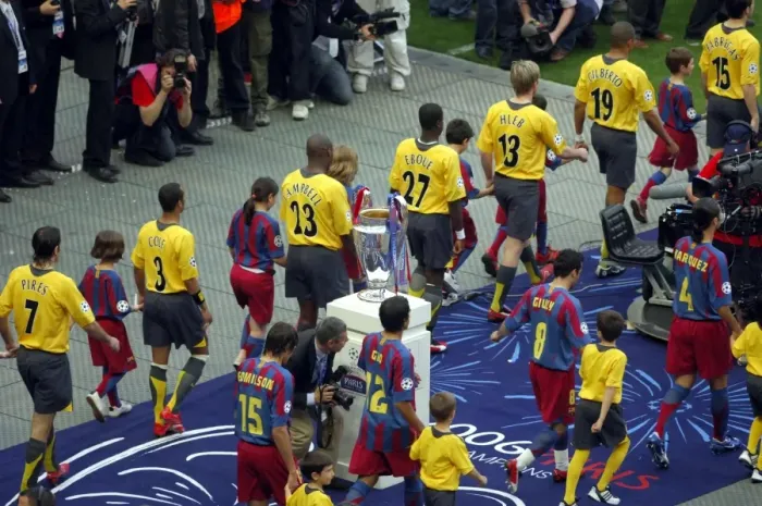 Framed Print : The Arsenal and Barcelona teams walk out past the European Cup