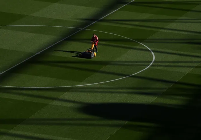 Framed Print : Arsenal: Battle Ready - Pre-Match Groundskeepers at Emirates Stadium