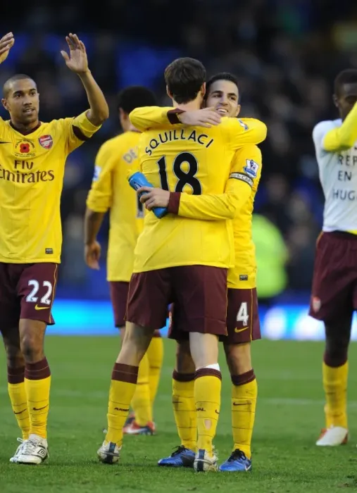 Framed Print : Arsenal captain Cesc Fabregas celebrates after the match with Sebastien Squillaci