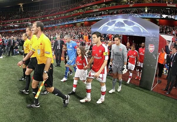 Arsenal captain Cesc Fabregas leads out the team before the match