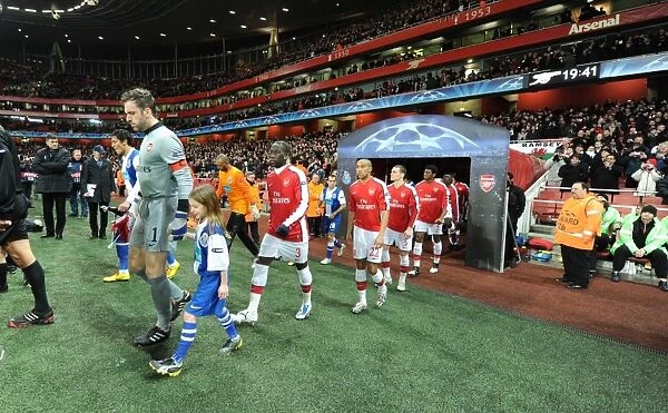 Arsenal captain Manuel Almunia followed by Bacary Sagna and Gael Clichy leads out the team before the match. Arsenal 5: 0 FC Porto, UEFA Champions League First Knockout Round, Second Leg, Emirates Stadium, Arsenal Football Club, London, 9  /  3  /  2010. Credit: Stuart MacFarlane  /  Arsenal