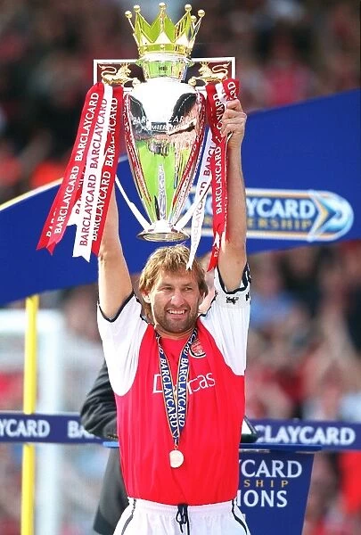 Arsenal captain Tony Adams with the F. A. Barclaycard Premiership Trophy