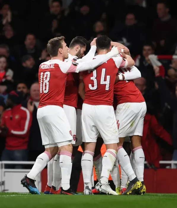 Framed Print : Arsenal Celebrate Double Strike Against Stade Rennais in Europa League
