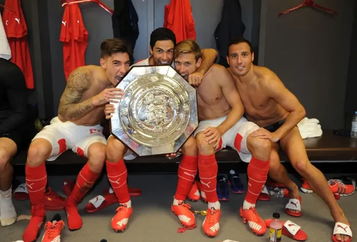 Framed Print : Arsenal Celebrate FA Community Shield Victory over Chelsea (2015-16): Hector Bellerin, Mikel Arteta, Nacho Monreal, and Santi Cazorla Rejoice