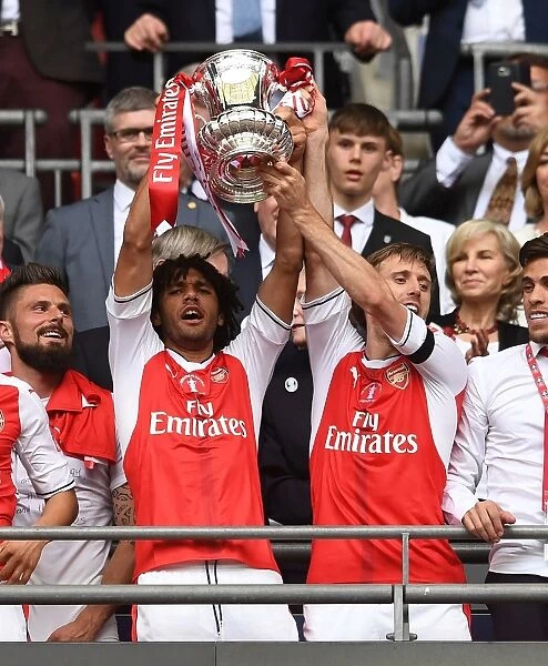 Arsenal Celebrate FA Cup Victory: Elneny and Monreal Lift the Trophy (Arsenal v Chelsea, 2017)