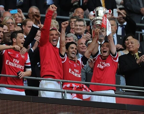 Arsenal Celebrate FA Cup Victory: Ozil, Podolski, Arteta & Vermaelen Lift the Trophy