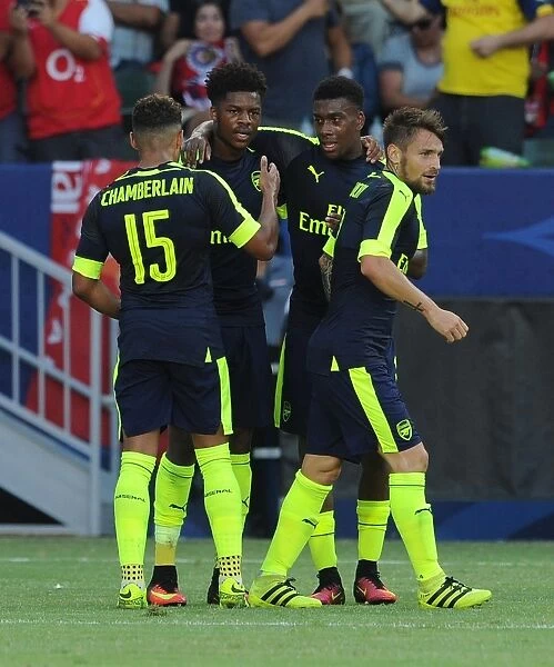 Arsenal Celebrate Goals: Akpom, Oxlade-Chamberlain, Iwobi, and Debuchy (2016-17)