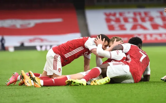 Framed Print : Arsenal Celebrate Martin Odegaard's Goal Against Tottenham in Empty Emirates Stadium
