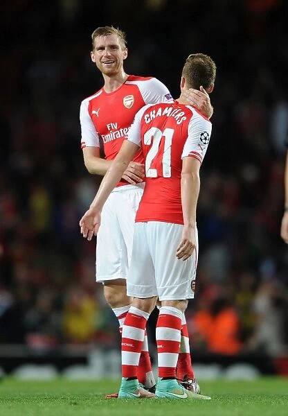 Arsenal Celebrate: Mertesacker and Chambers Reunite after Arsenal's Victory over Galatasaray (2014 / 15 Champions League)