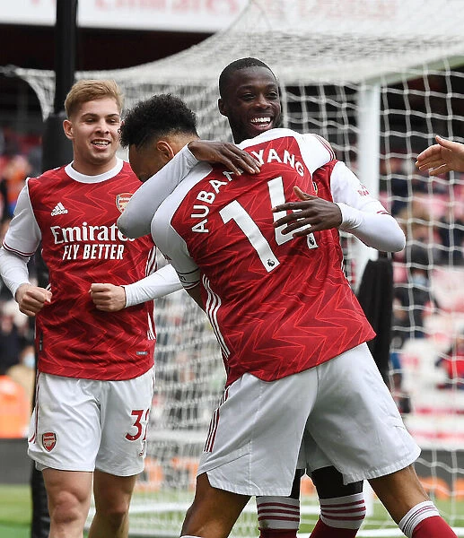 Arsenal Celebrate with Nicolas Pepe and Pierre-Emerick Aubameyang: Arsenal v Brighton & Hove Albion, Premier League 2021