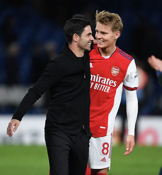Arsenal Celebrate Victory Over Chelsea in Premier League Clash: Mikel Arteta and Martin Odegaard