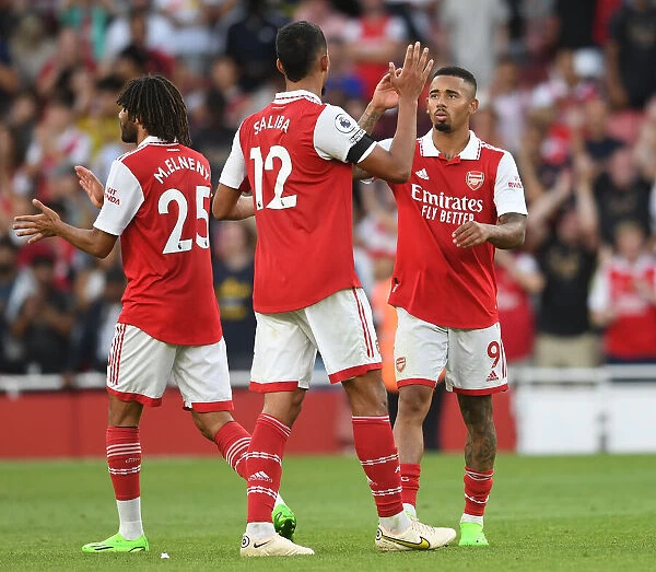 Arsenal Celebrate Victory: Gabriel Jesus and William Saliba Embrace After Arsenal FC vs Fulham FC in 2022-23 Premier League