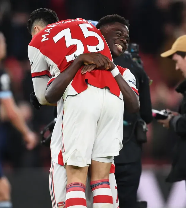 Framed Print : Arsenal Celebrate Victory: Martinelli and Saka Rejoice After Arsenal v West Ham United (2021-22)