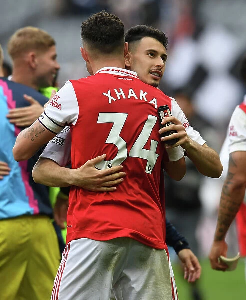 Arsenal Celebrate Victory: Martinelli and Xhaka Embrace Post-Match at Newcastle United