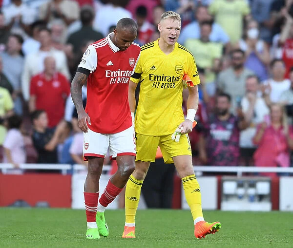 Arsenal Celebrate Win Against Fulham: Ramsdale and Magalhaes Embrace