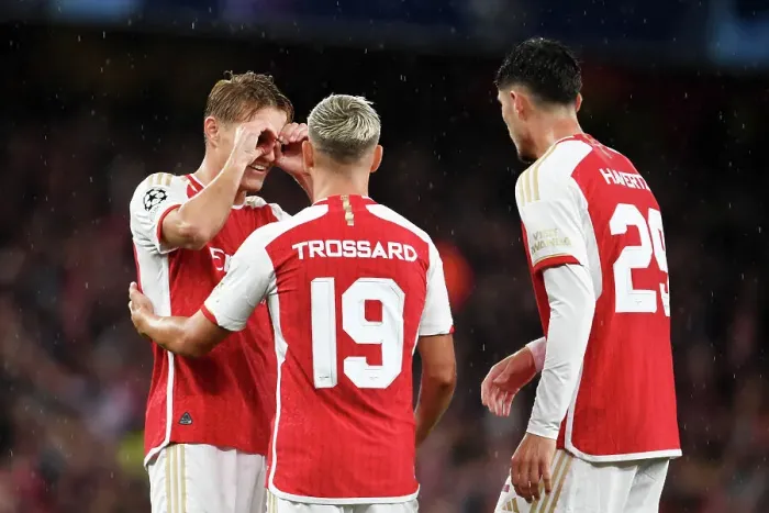 Framed Print : Arsenal Celebrates Double Strike: Trossard and Odegaard Score Against PSV Eindhoven in Champions League 2023 / 24