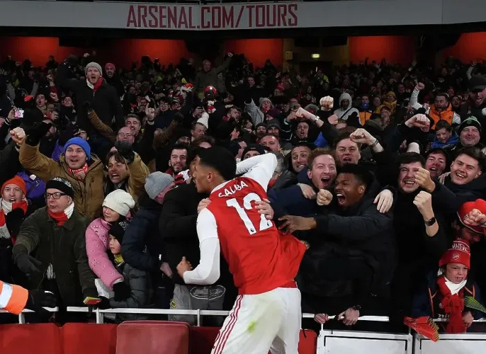 Framed Print : Arsenal Celebrates Third Goal Against Manchester United: Saliba's Emotional Moment with Fans (2022-23) Framed Print : Arsenal Celebrates Third Goal Against Manchester United: Saliba's Emotional Moment with Fans (2022-23)
