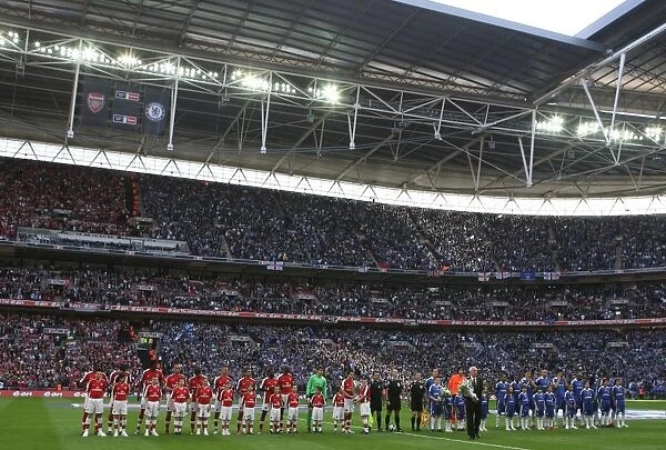 The Arsenal and Chelsea teams line up before the match