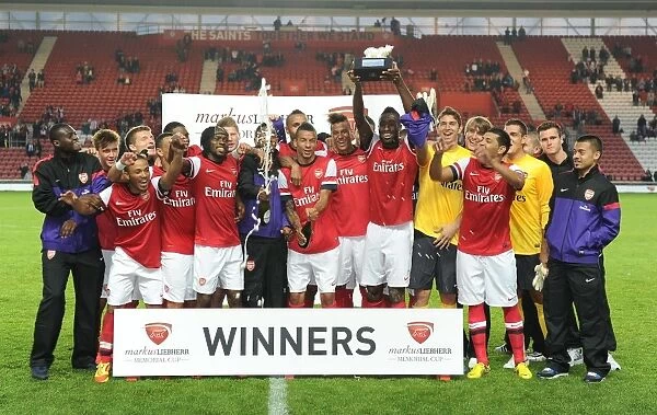 Arsenal Claims Victory in Markus Liebherr Memorial Cup: Arsenal Team Celebrates Pre-Season Win Against Southampton (2012-13)