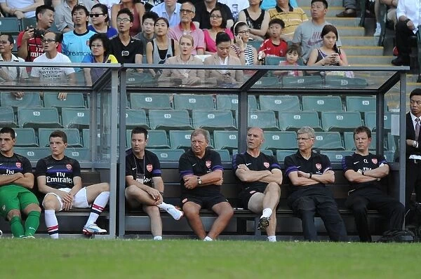 Arsenal Coaching Team at Kitchee FC Match (2012): Wenger, Bould, Akers, and Lewin