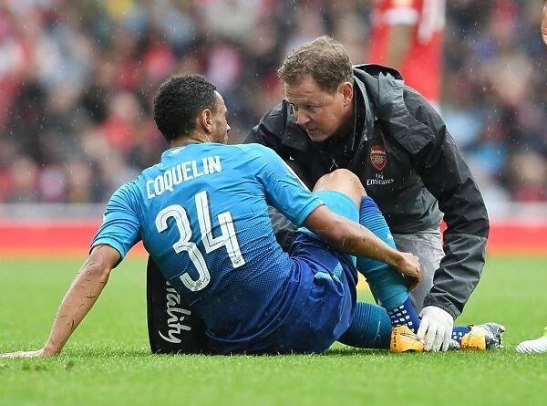 Arsenal: Colin Lewin Tends to Injured Francis Coquelin during Arsenal v Benfica Emirates Cup Match