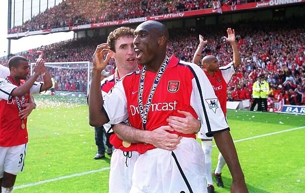 Arsenal defenders Martin Keown and Sol Campbell celebrate after the match