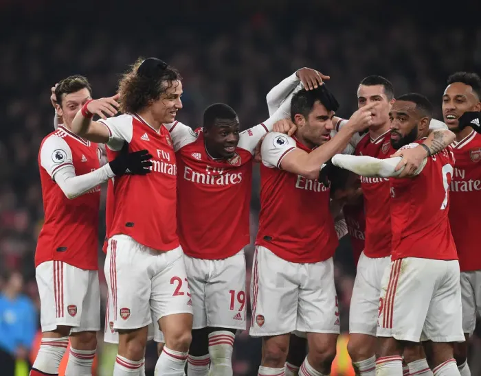 Framed Print : Arsenal Double Over Manchester United: Sokratis, Ozil, Luiz, Maitland-Niles, Aubameyang, Lacazette, and Xhaka Celebrate Glorious Victory (January 2020)