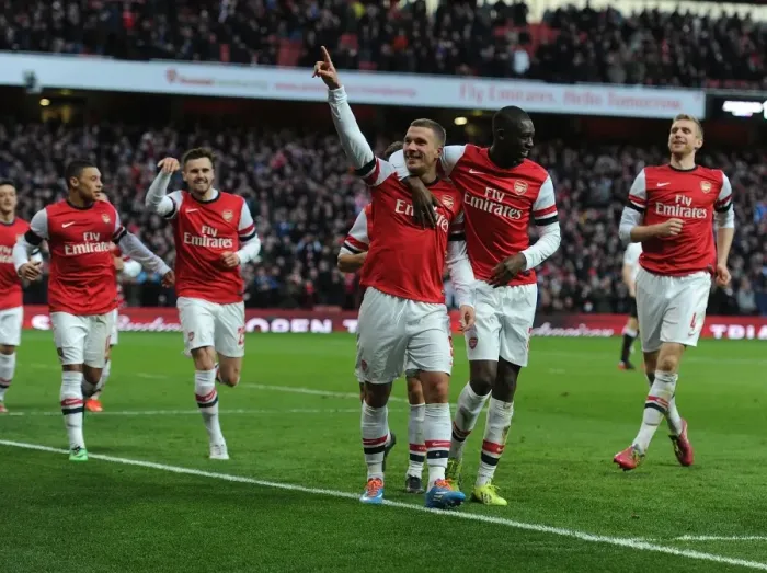 Framed Print : Arsenal Double Strike: Podolski and Sanogo Celebrate Goals Against Liverpool in FA Cup Framed Print : Arsenal Double Strike: Podolski and Sanogo Celebrate Goals Against Liverpool in FA Cup