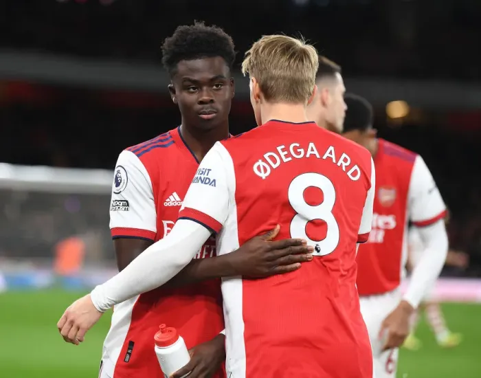 Framed Print : Arsenal Duo Bukayo Saka and Martin Odegaard Pre-Match Huddle vs. Wolverhampton Wanderers (Premier League 2021-22) Framed Print : Arsenal Duo Bukayo Saka and Martin Odegaard Pre-Match Huddle vs. Wolverhampton Wanderers (Premier League 2021-22)