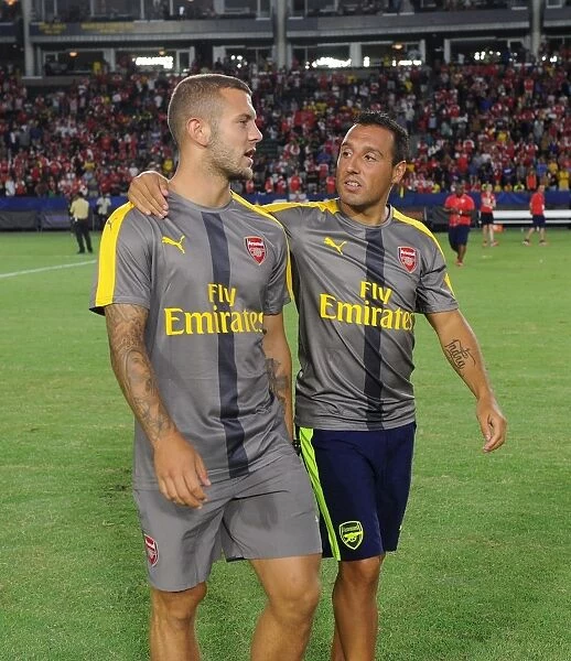 Arsenal Duo: Jack Wilshere and Santi Cazorla Share a Moment after Arsenal v Chivas (2016-17)