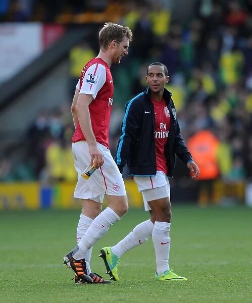 Arsenal Duo Per Mertesacker and Theo Walcott Departing the Field: Norwich City vs. Arsenal, Premier League, 2011