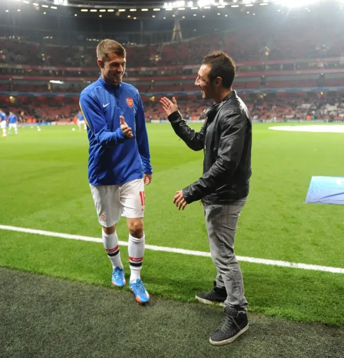 Framed Print : Arsenal Duo: Santi Cazorla and Aaron Ramsey Share a Moment Before Arsenal v Napoli, 2013-14 UEFA Champions League