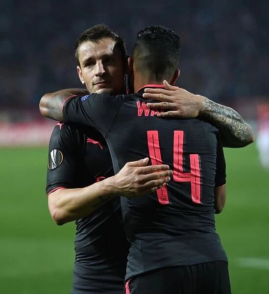 Arsenal Duo: Walcott and Debuchy Share a Moment after Red Star Belgrade Match, 2017