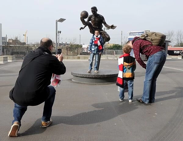 Arsenal FA Cup Quarter-Final: Fans Gather Around Dennis Bergkamp Statue