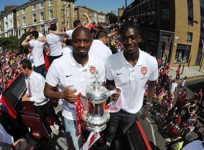 Framed Print : Arsenal FA Cup Victory: Abou Diaby and Yaya Sanogo Celebrate with the Trophy