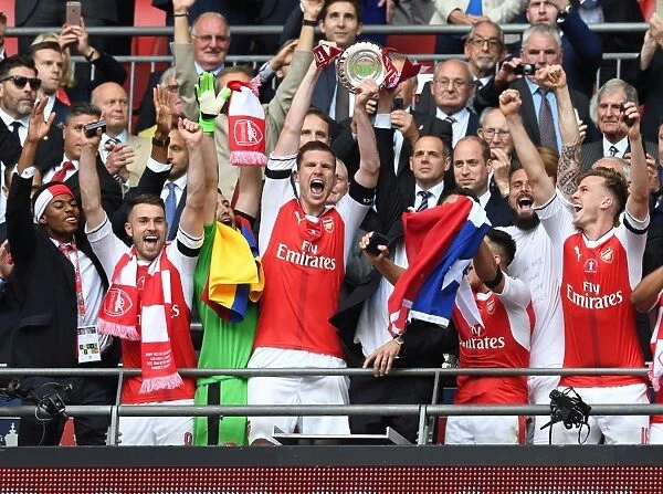 Arsenal FA Cup Victory: Mertesacker and the Trophy Surrounded by Ramsey, Holding, and Sanchez