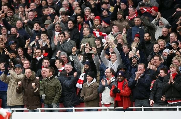 Arsenal fans celebrate the 1st goal. Arsenal 3: 0 Aston Villa. Barclays Premier League