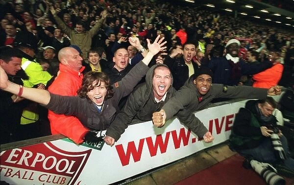 Arsenal fans celebrate the 3rd Arsenal goal scored by Thierry Henry
