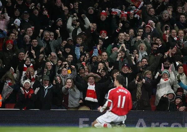 Arsenal fans celebrate the 3rd goal, scored by Robin van Persie