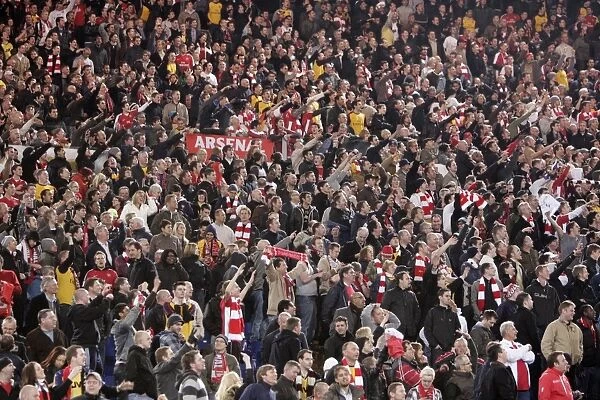Arsenal fans celebrate at the end of the match