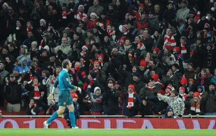 Framed Print : Arsenal fans celebrate after goalkeeper Manuel Almunia saves the Hull penalty taken by Geovanni