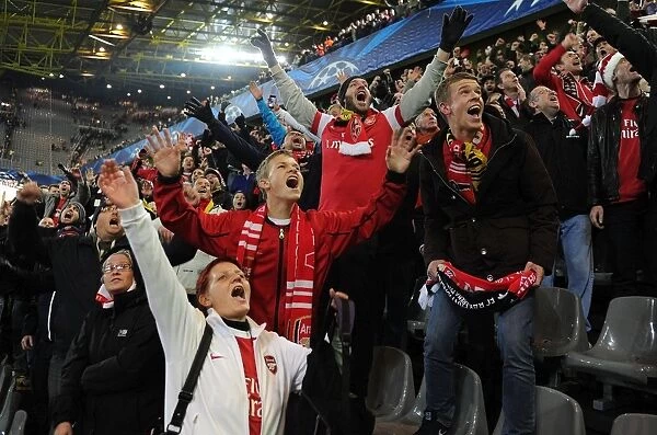 Arsenal Fans Celebrate Victory Over Borussia Dortmund in UEFA Champions League