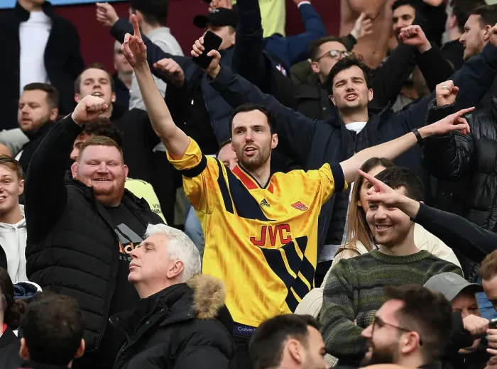 Framed Print : Arsenal Fans Euphoria: Victory Celebration vs. Aston Villa in Premier League