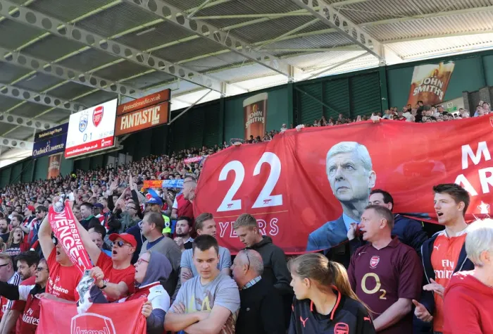 Framed Print : Arsenal Fans Honor Arsene Wenger with Banners at Huddersfield Match