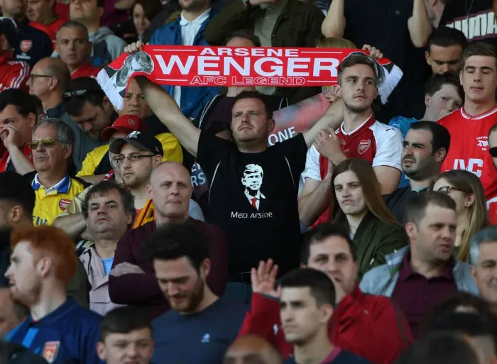 Framed Print : Arsenal Fans Honor Arsene Wenger with Banners at Huddersfield Match