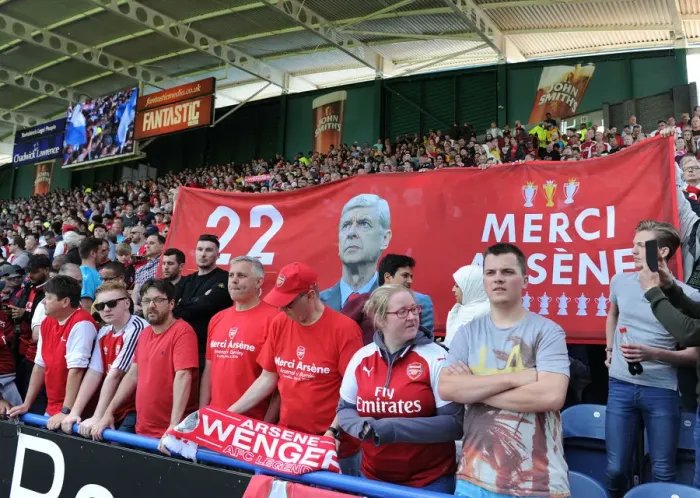 Framed Print : Arsenal Fans Honor Arsene Wenger with Banners at Huddersfield Match
