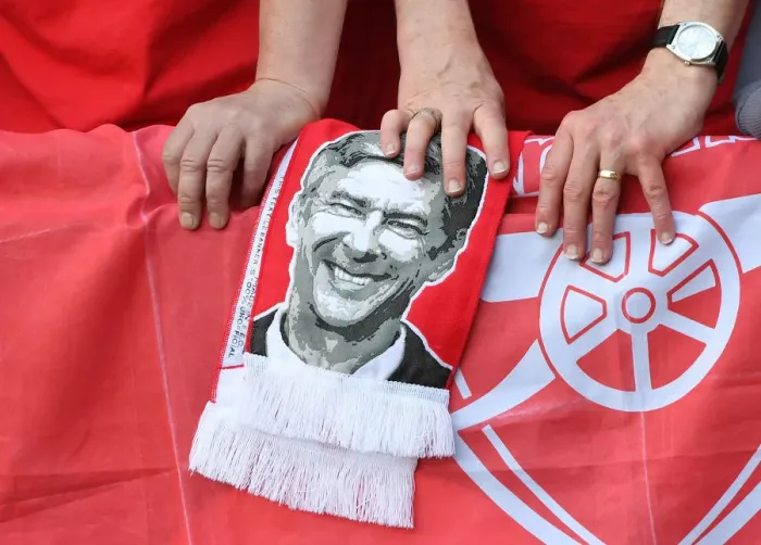 Framed Print : Arsenal Fans Honor Arsene Wenger with Banners at Huddersfield Match