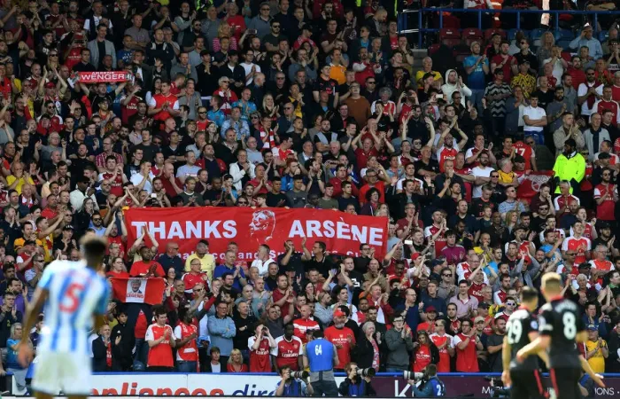 Framed Print : Arsenal Fans Honor Arsene Wenger with Banners at Huddersfield Match
