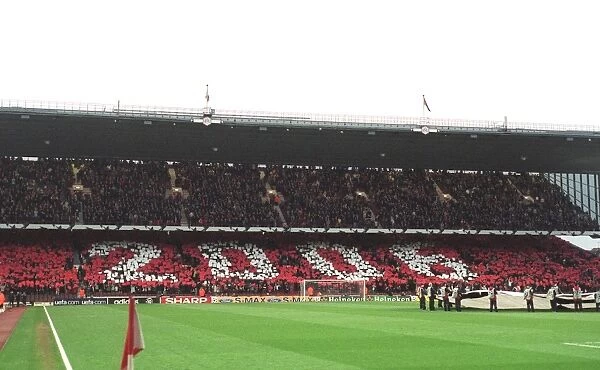 Arsenal fans in the North Bank hold up cards that read 2006