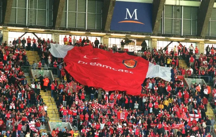 Framed Print : Arsenal fans pass over the giant shirt. Arsenal 2: 0 Chelsea. The AXA F Framed Print : Arsenal fans pass over the giant shirt. Arsenal 2: 0 Chelsea. The AXA F